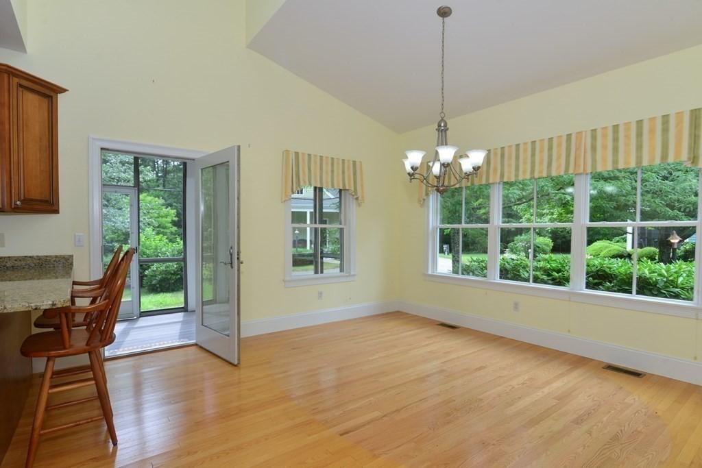 15 Hathaway Pond Circle, Unit 15 Rochester, MA 02770 - Photo 6 of 36 a view of a room with furniture window and wooden floor
