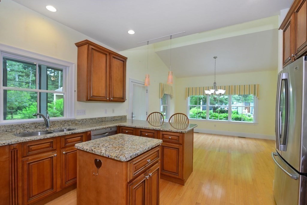 15 Hathaway Pond Circle, Unit 15 Rochester, MA 02770 - Photo 7 of 36 a kitchen with a sink a counter top space and stainless steel appliances