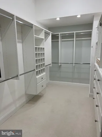 a view of an empty walk in closet