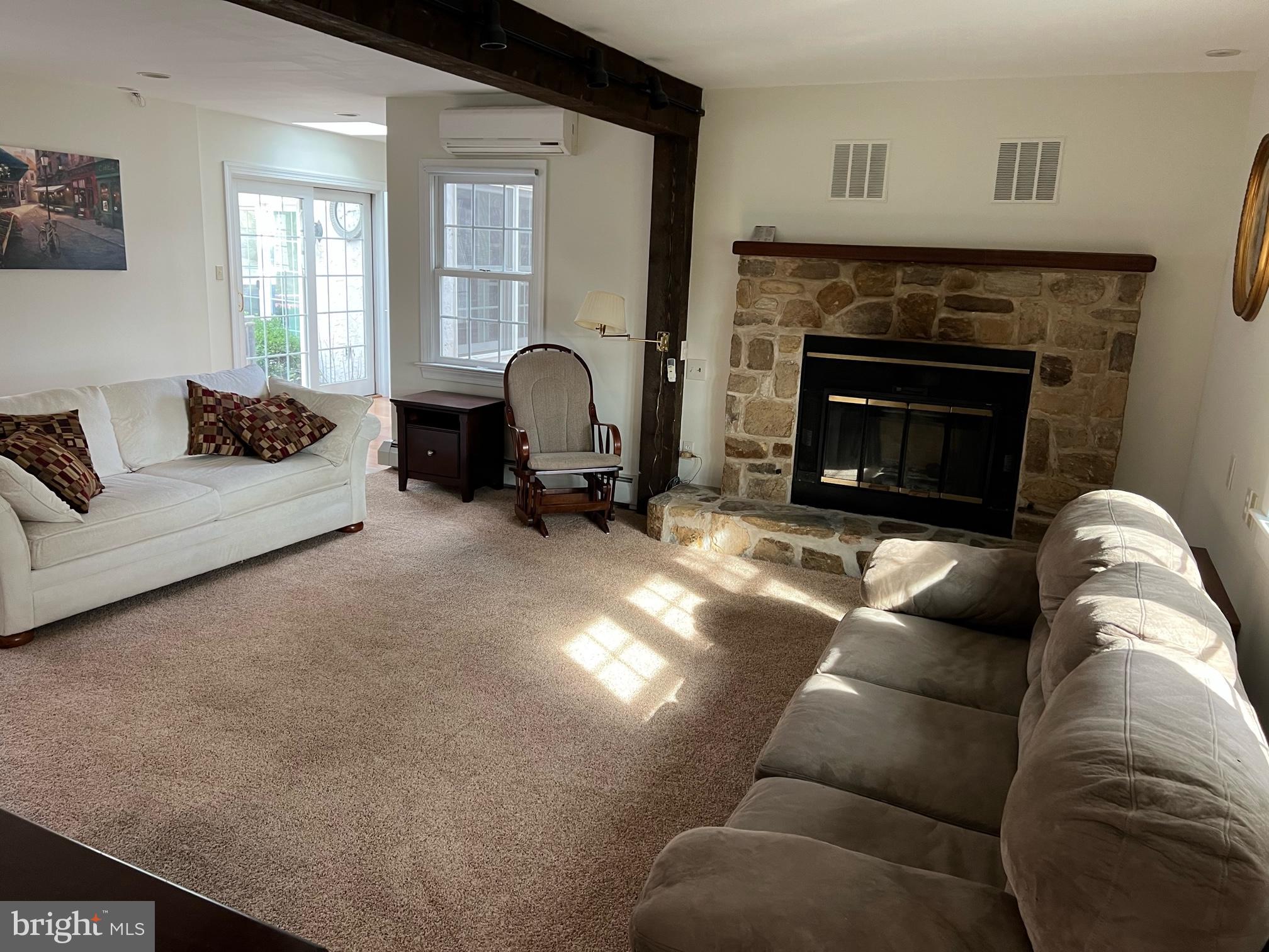 908 Lincoln Road Phoenixville, PA 19460 - Photo 16 of 26 a living room with furniture and a fireplace