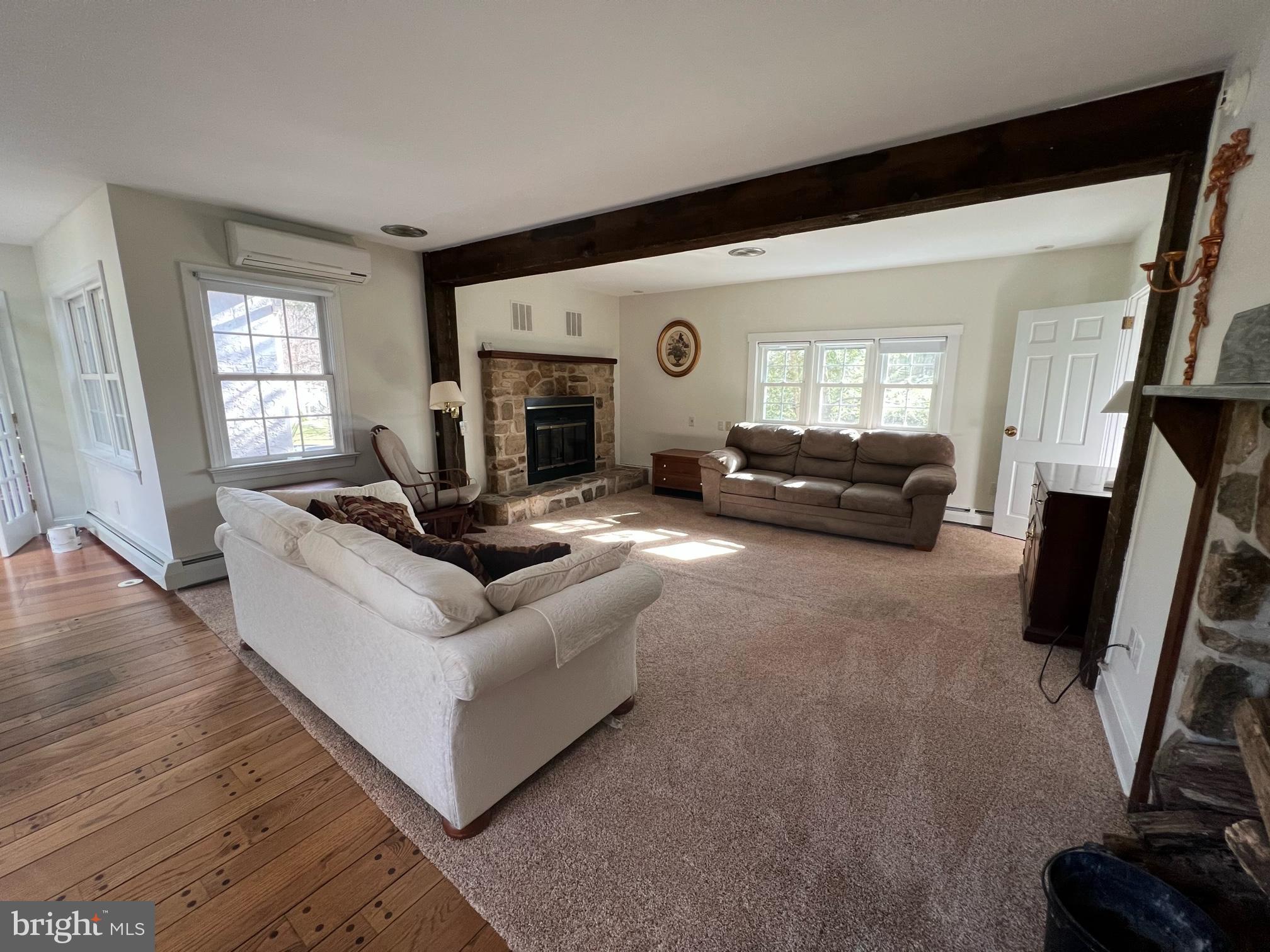 908 Lincoln Road Phoenixville, PA 19460 - Photo 23 of 26 a living room with furniture and a fireplace