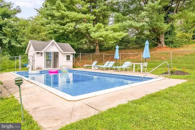 a view of a house with swimming pool