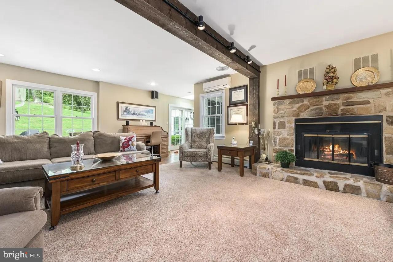 908 Lincoln Road Phoenixville, PA 19460 - Photo 5 of 26 a living room with furniture and a fireplace