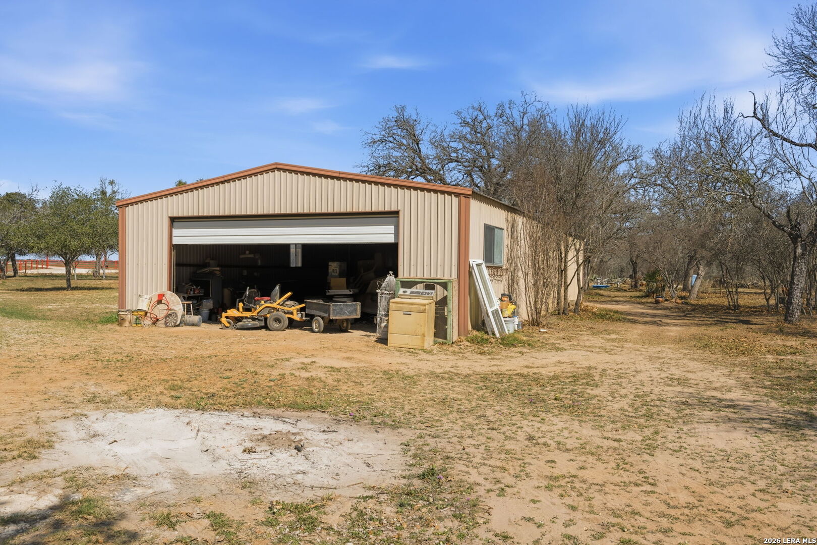 1150 Bruce Road Poteet, TX 78065 - Photo 32 of 33 a view of a house with a patio