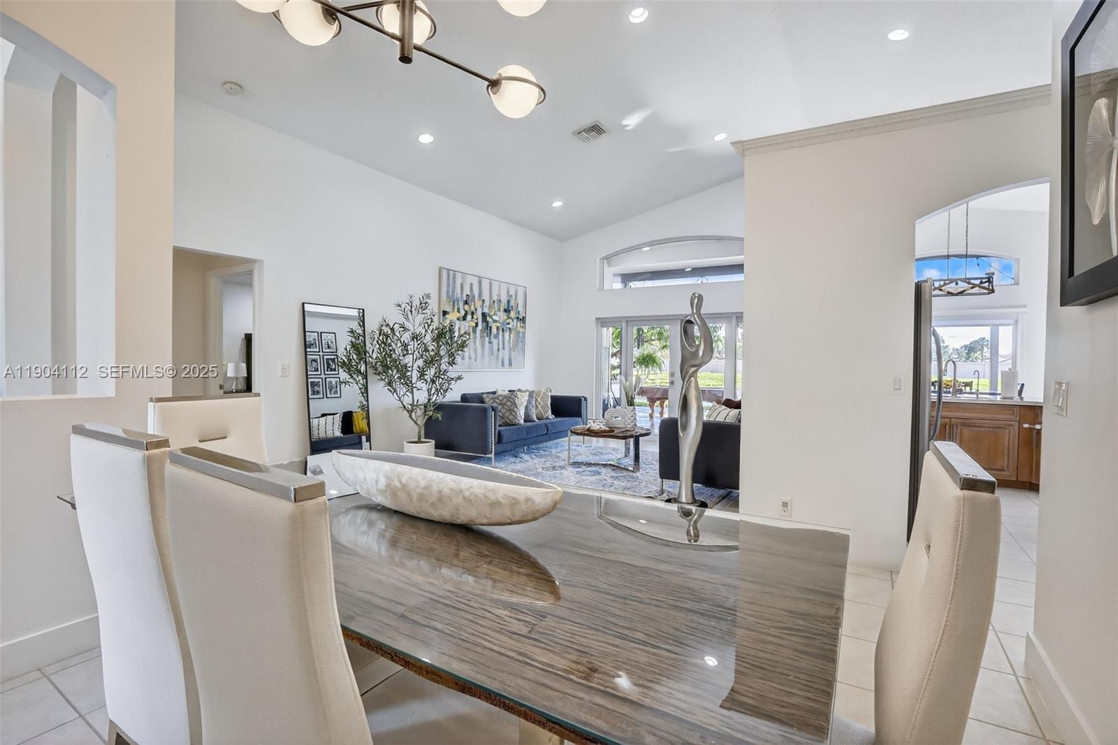 18950 Southwest 16th Street, Unit 1950 Pembroke Pines, FL 33029 - Photo 11 of 51 a view of a living room and dining room
