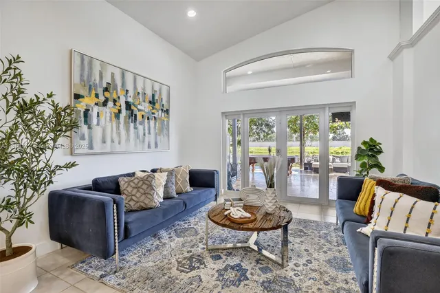 a living room with furniture and a rug