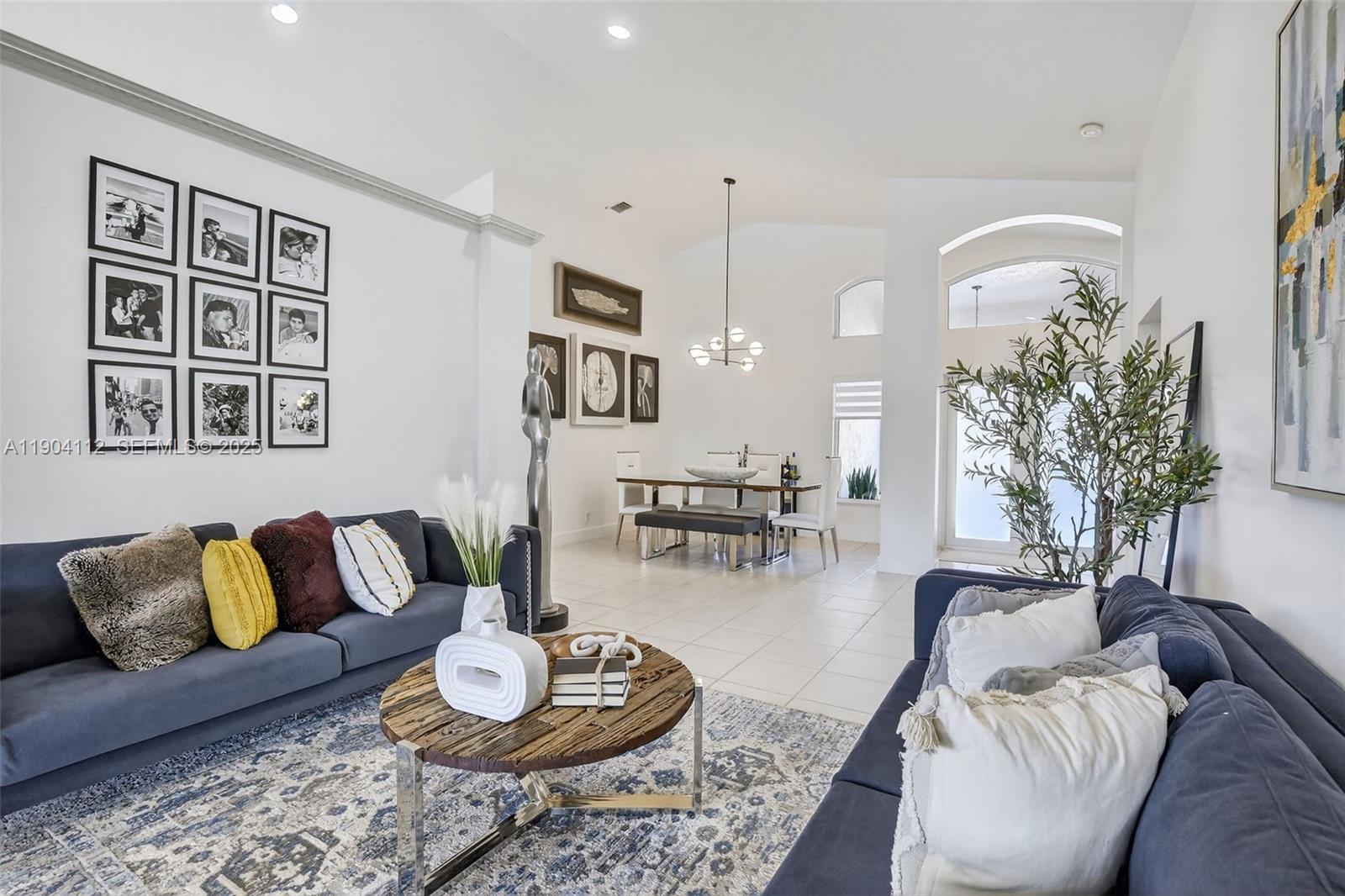 18950 Southwest 16th Street, Unit 1950 Pembroke Pines, FL 33029 - Photo 13 of 51 a living room with furniture and a rug