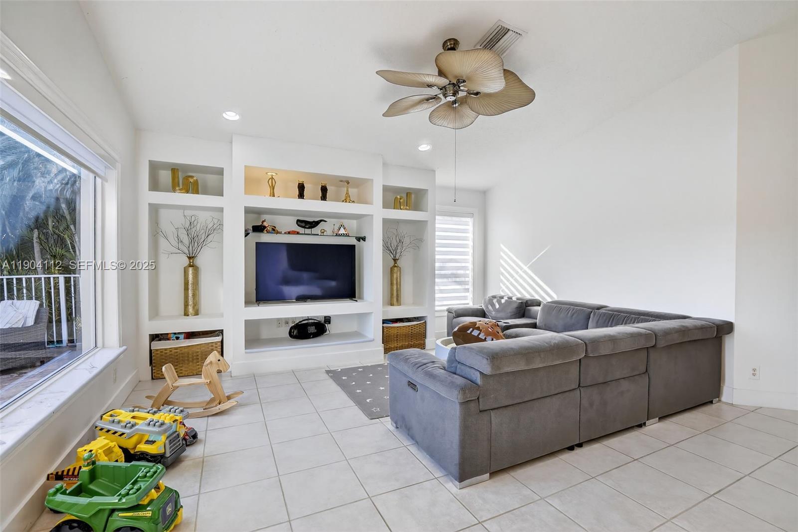 18950 Southwest 16th Street, Unit 1950 Pembroke Pines, FL 33029 - Photo 19 of 51 a living room with furniture and a fireplace
