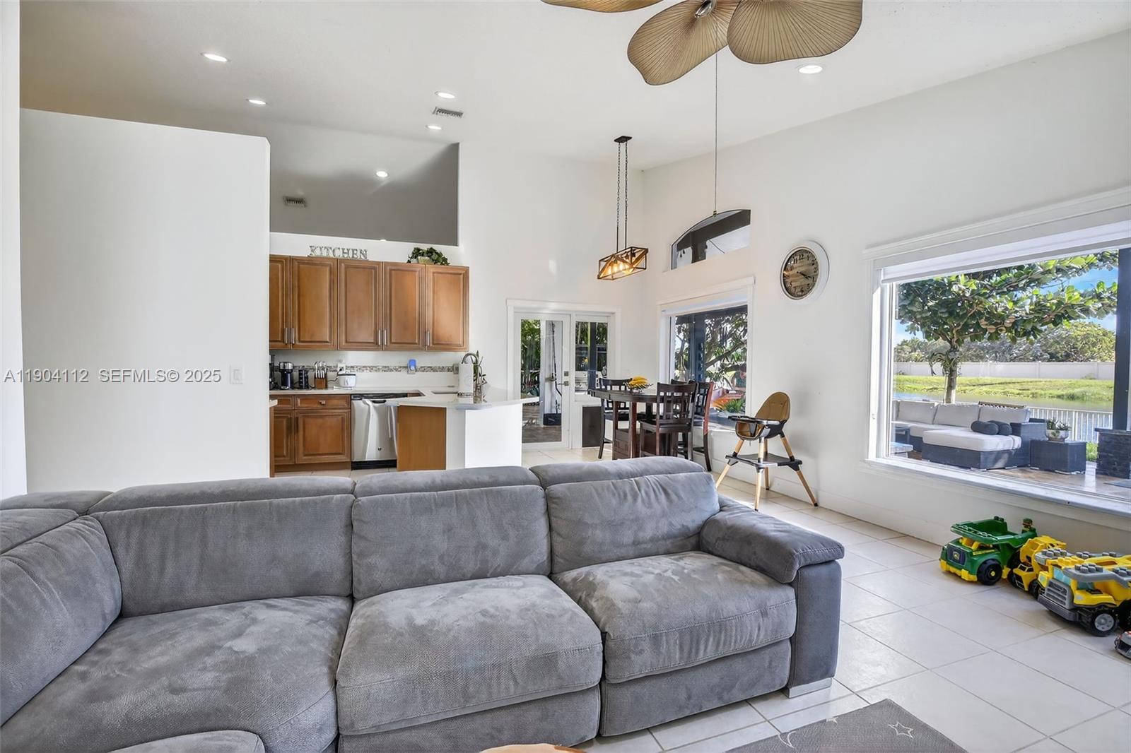 18950 Southwest 16th Street, Unit 1950 Pembroke Pines, FL 33029 - Photo 21 of 51 a living room with furniture fireplace and a large window