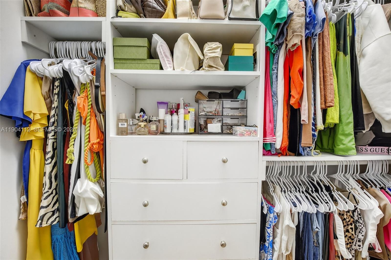 18950 Southwest 16th Street, Unit 1950 Pembroke Pines, FL 33029 - Photo 28 of 51 a view of walk in closet with clothes and shoes