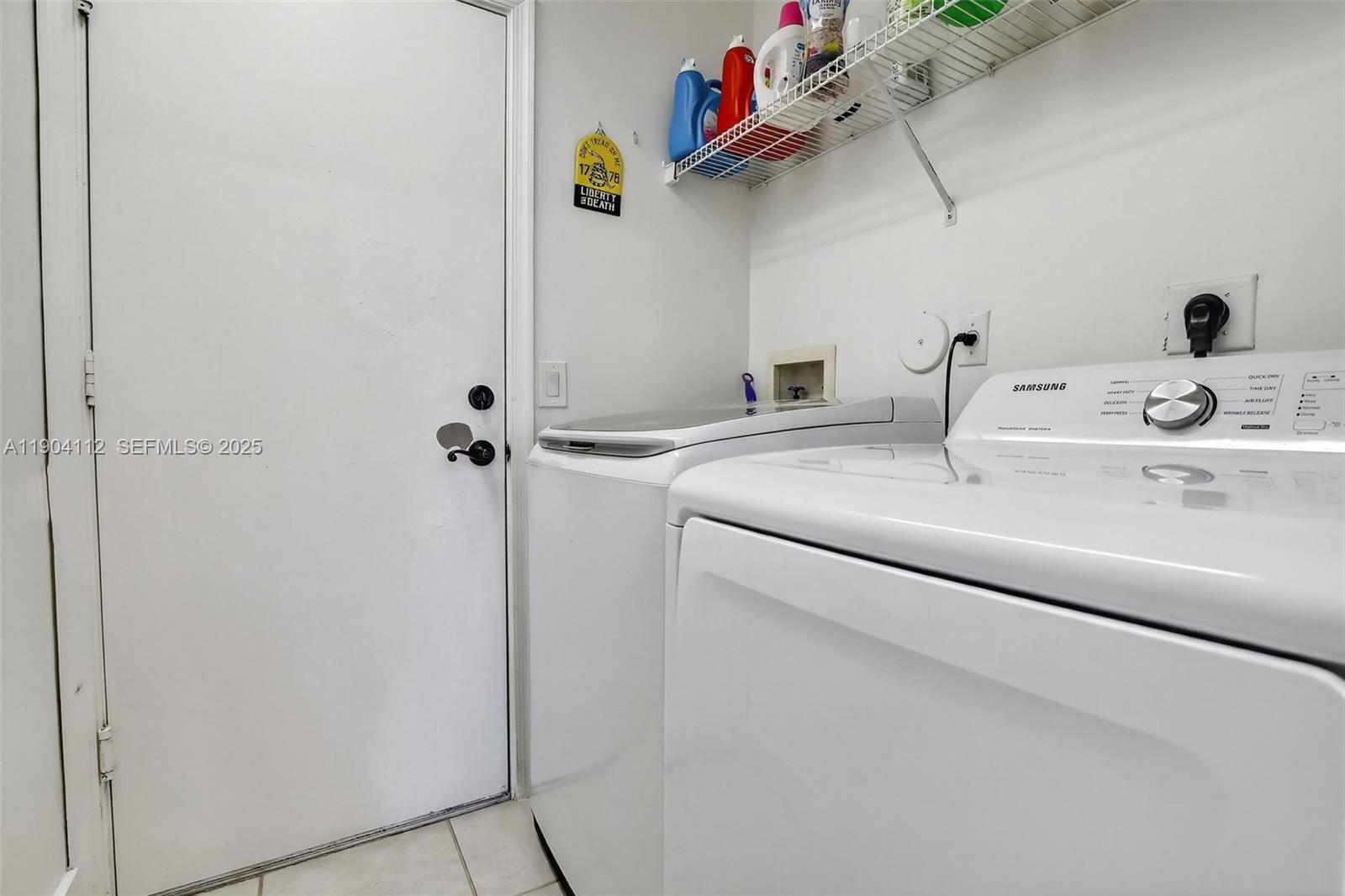 18950 Southwest 16th Street, Unit 1950 Pembroke Pines, FL 33029 - Photo 34 of 51 a utility room with dryer and washer