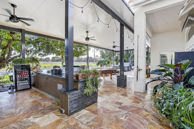 a view of a house with backyard and sitting area