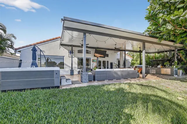 a view of a patio with swimming pool table and chairs