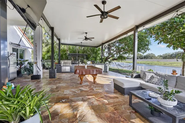 an aerial view of lake and residential houses with outdoor space