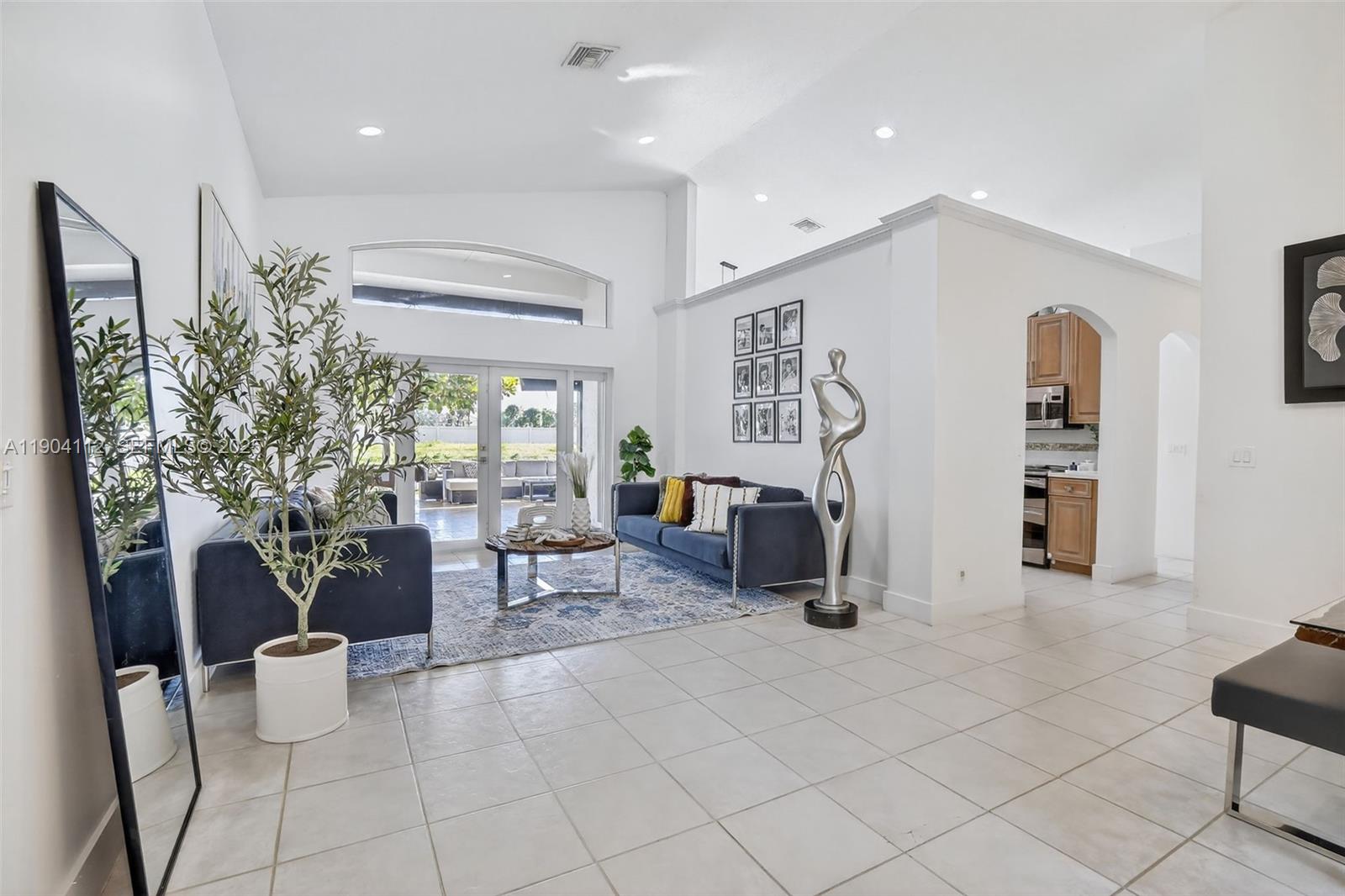 18950 Southwest 16th Street, Unit 1950 Pembroke Pines, FL 33029 - Photo 9 of 51 a living room with furniture and white walls