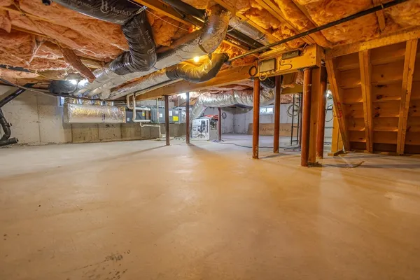a view of empty room with wooden ceiling
