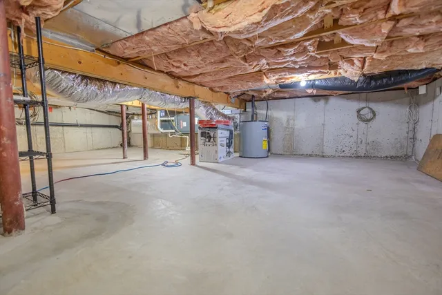 a view of a backyard with table and chairs and wooden fence