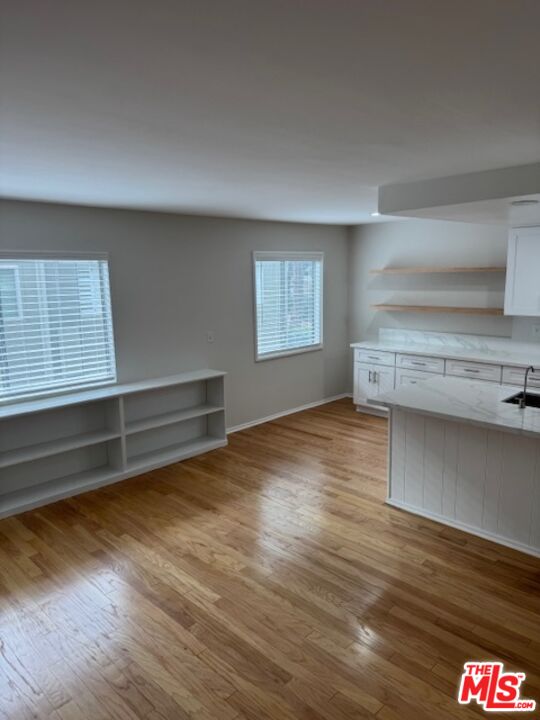 13322 Maxella Avenue, Unit 2 Marina del Rey, CA 90292 - Photo 3 of 20 a view of empty room with wooden floor and fan