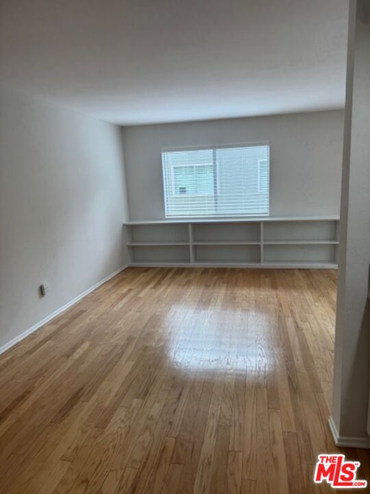 13322 Maxella Avenue, Unit 2 Marina del Rey, CA 90292 - Photo 5 of 20 a view of room with wooden floor and white walls