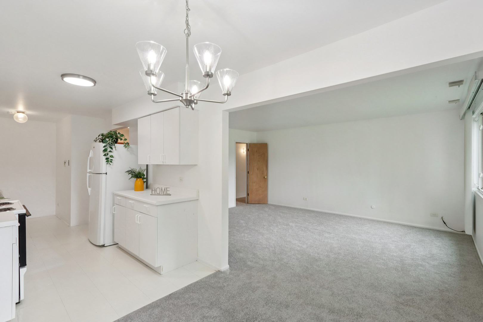 2650 Brookwood Way Drive, Unit 201B Rolling Meadows, IL 60008 - Photo 14 of 25 a view of a kitchen with furniture and wooden floor