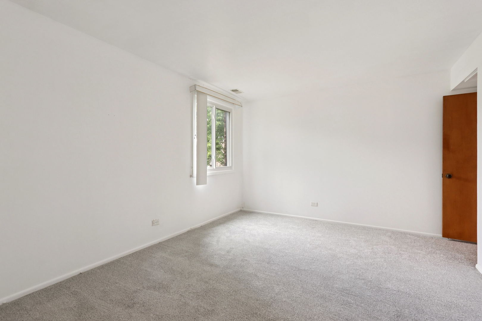 2650 Brookwood Way Drive, Unit 201B Rolling Meadows, IL 60008 - Photo 19 of 25 an empty room with windows