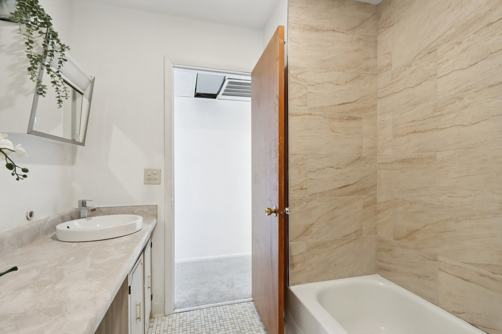 2650 Brookwood Way Drive, Unit 201B Rolling Meadows, IL 60008 - Photo 22 of 25 a bathroom with a granite countertop sink a toilet and shower
