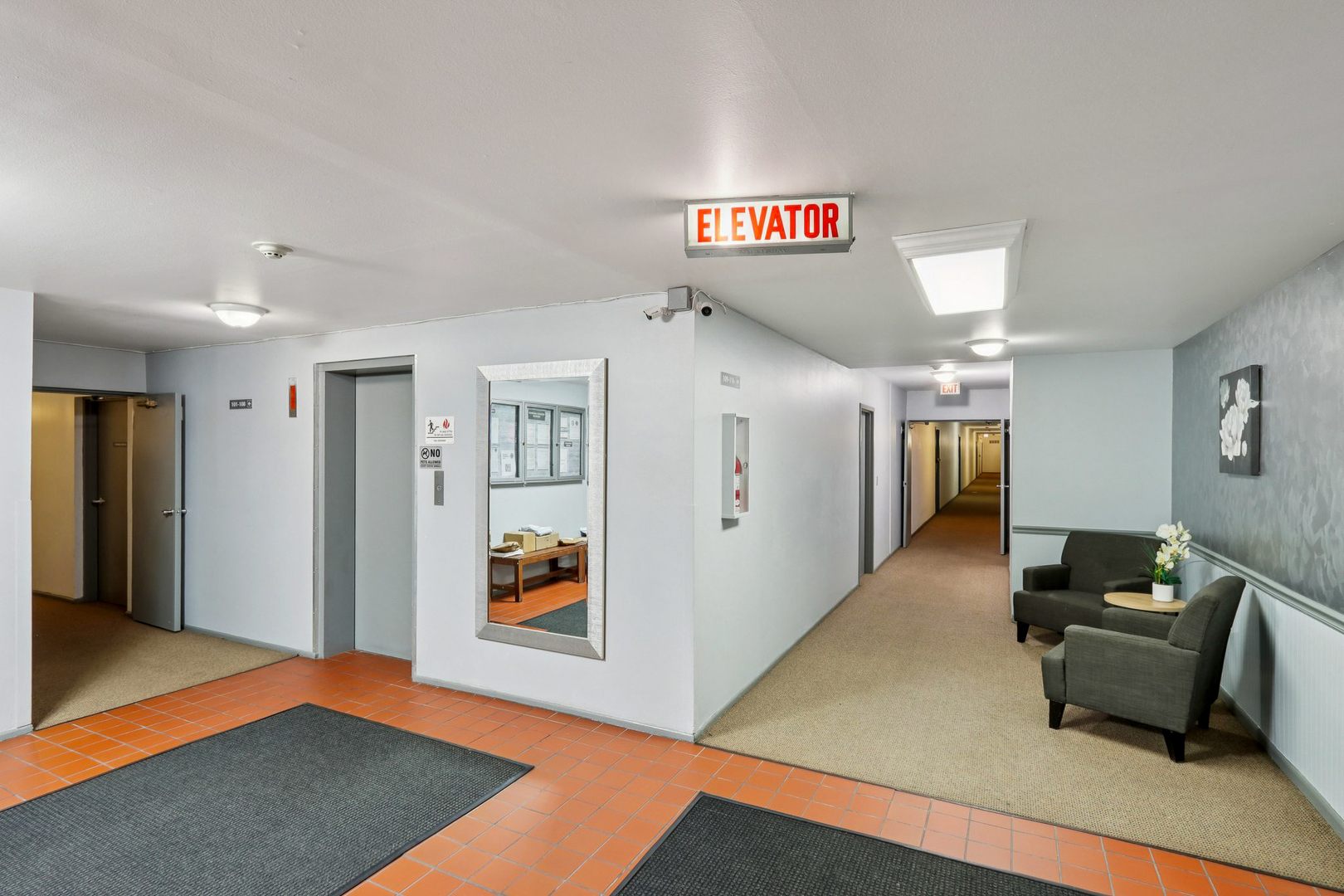 2650 Brookwood Way Drive, Unit 201B Rolling Meadows, IL 60008 - Photo 4 of 25 a living room with furniture and a rug