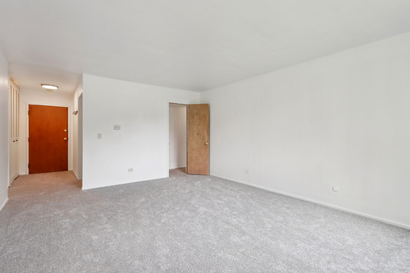 2650 Brookwood Way Drive, Unit 201B Rolling Meadows, IL 60008 - Photo 8 of 25 an empty room with an entryway