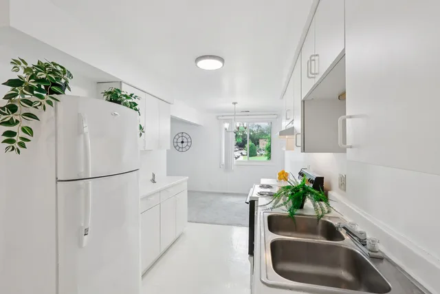 a white refrigerator freezer sitting in a kitchen
