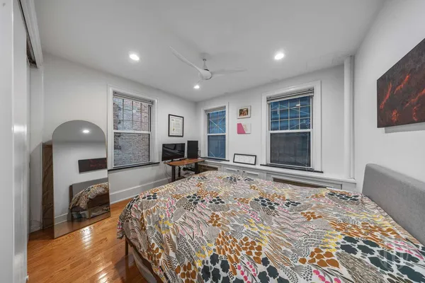 a bed room with a bed and a television