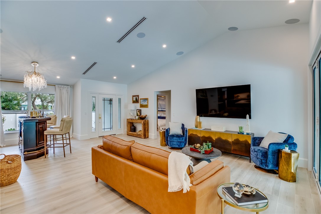 700 Holly Road Vero Beach, FL 32963 - Photo 12 of 36 a living room with furniture and a flat screen tv