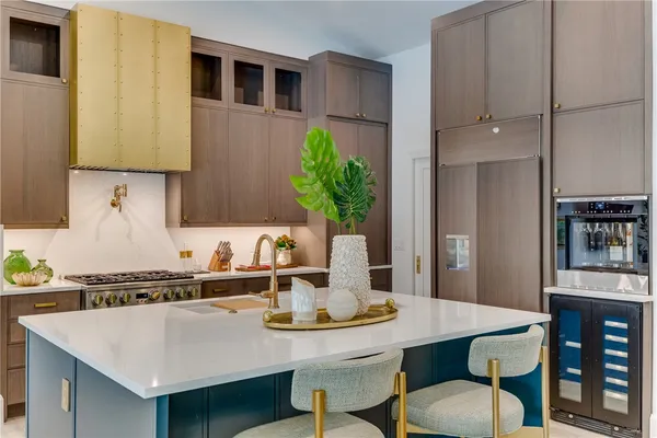 a kitchen with a table and chairs in it