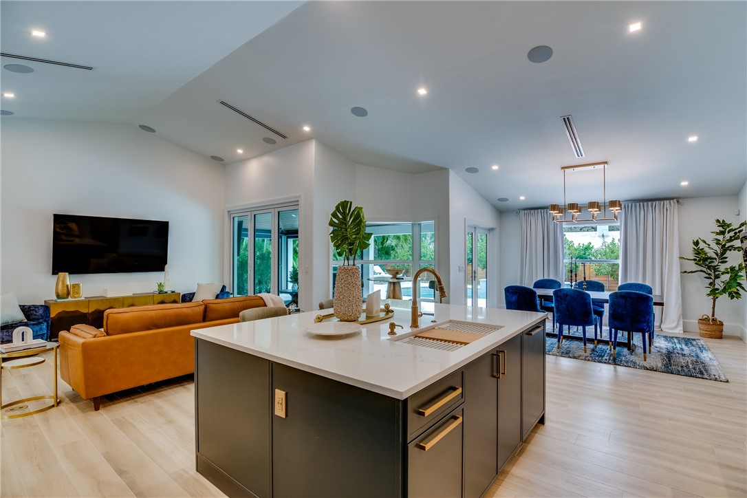 700 Holly Road Vero Beach, FL 32963 - Photo 18 of 36 a view of a dining room with furniture window and wooden floor