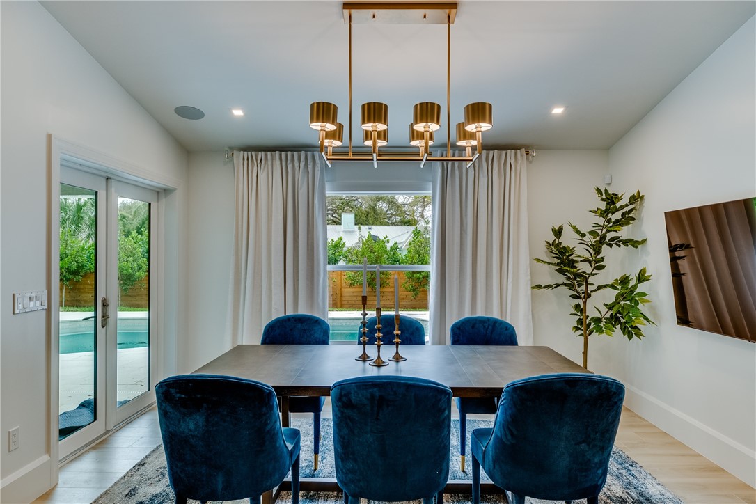 700 Holly Road Vero Beach, FL 32963 - Photo 21 of 36 a view of a dining room with furniture window and outside view