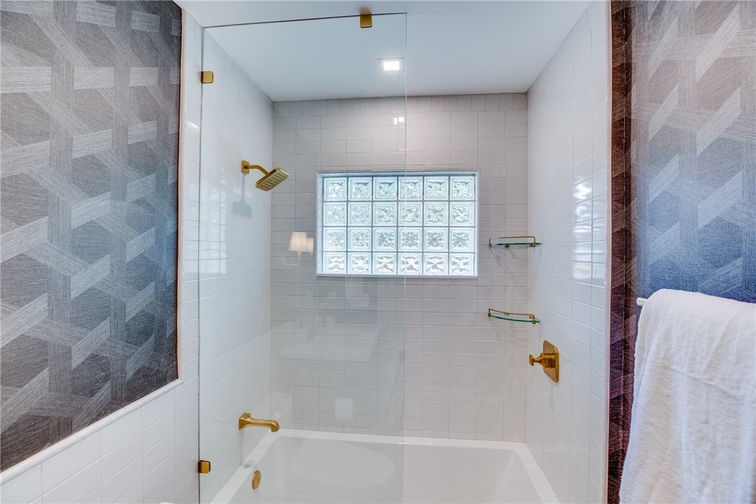 700 Holly Road Vero Beach, FL 32963 - Photo 29 of 36 a bathroom with a bathtub and a shower