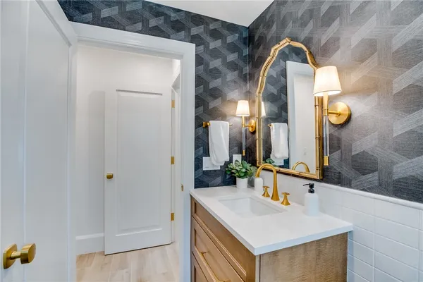 a bathroom with a sink and a mirror