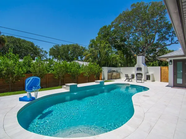 a view of a swimming pool with a patio