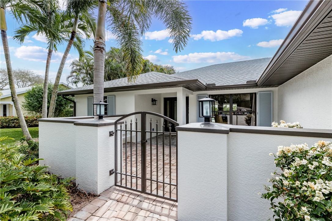 700 Holly Road Vero Beach, FL 32963 - Photo 36 of 36 front view of a house with a small yard