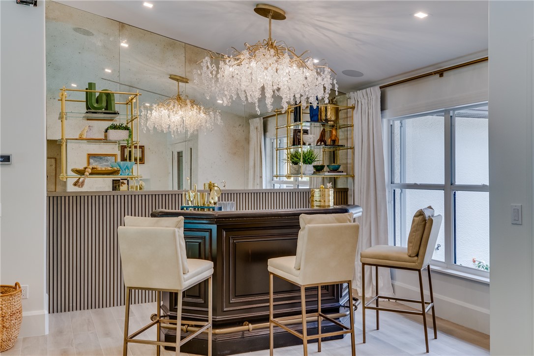 700 Holly Road Vero Beach, FL 32963 - Photo 6 of 36 a view of a dining room with furniture and chandelier