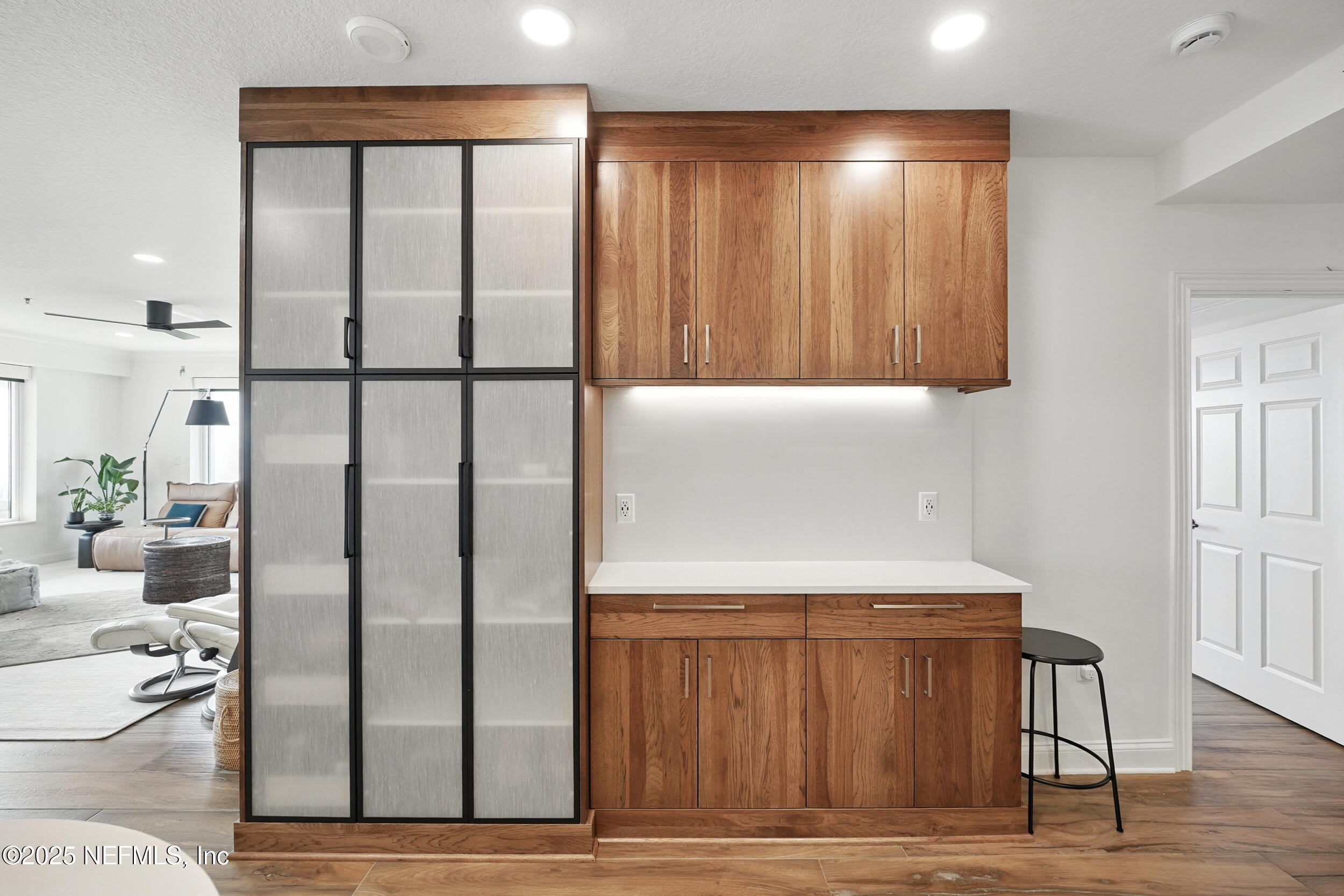 1505 1st Street South, Unit 302 Jacksonville Beach, FL 32250 - Photo 12 of 57 a kitchen with stainless steel appliances a refrigerator and wooden floor
