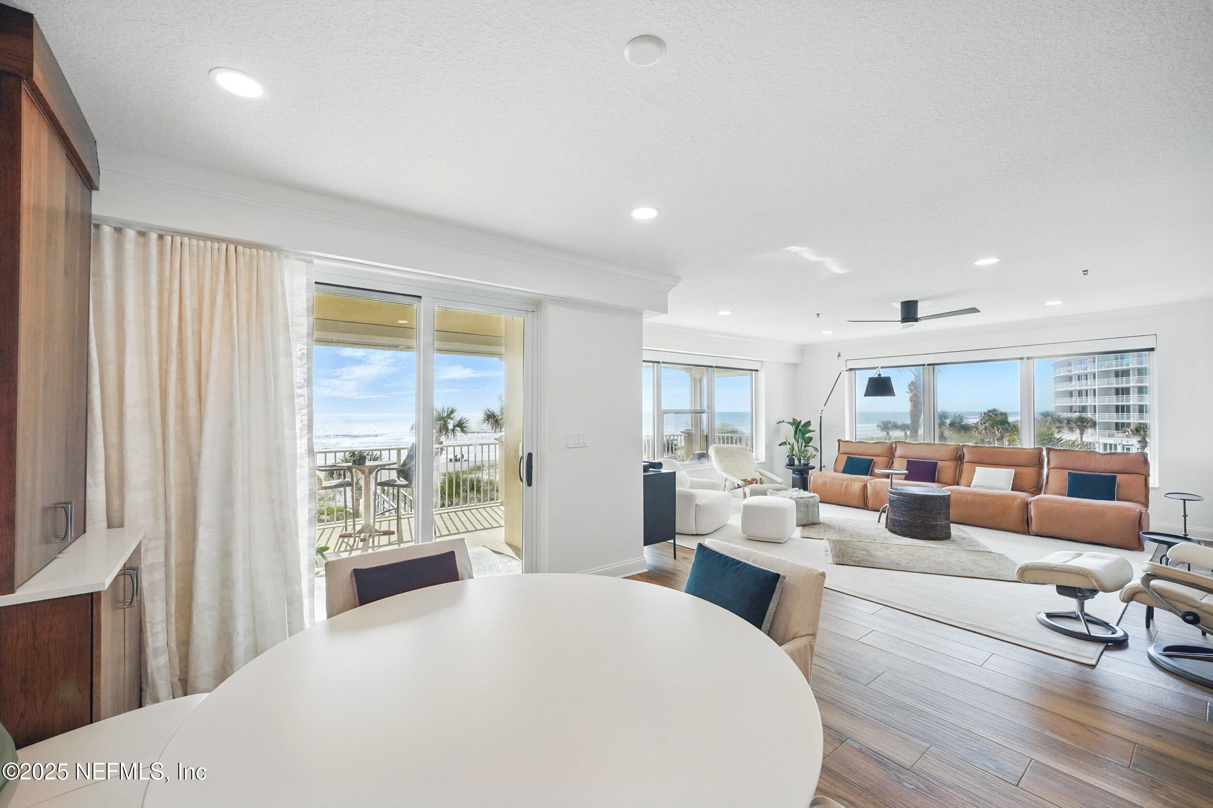 1505 1st Street South, Unit 302 Jacksonville Beach, FL 32250 - Photo 13 of 57 a living room with furniture and a large window