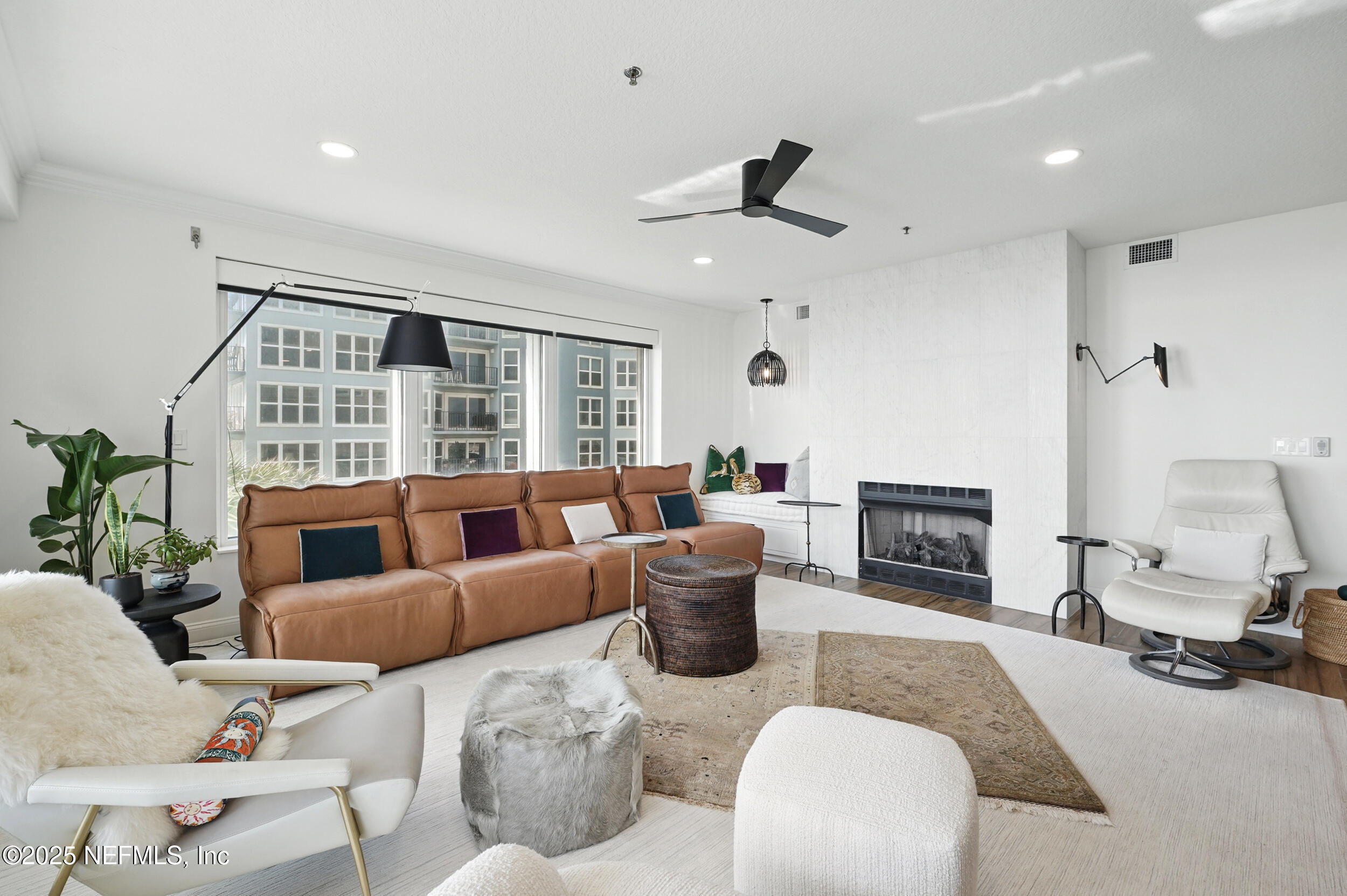 1505 1st Street South, Unit 302 Jacksonville Beach, FL 32250 - Photo 17 of 57 a living room with furniture and a fireplace