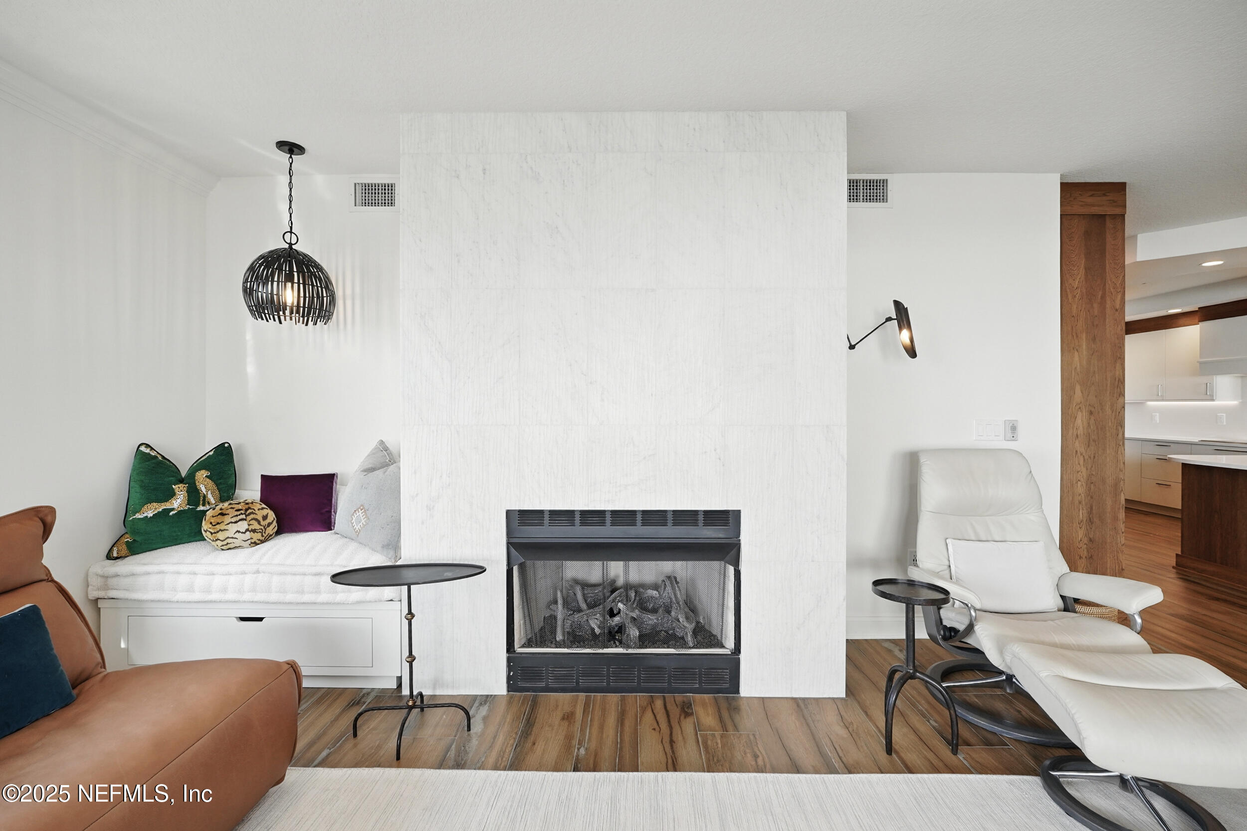 1505 1st Street South, Unit 302 Jacksonville Beach, FL 32250 - Photo 19 of 57 a living room with furniture and a flat screen tv