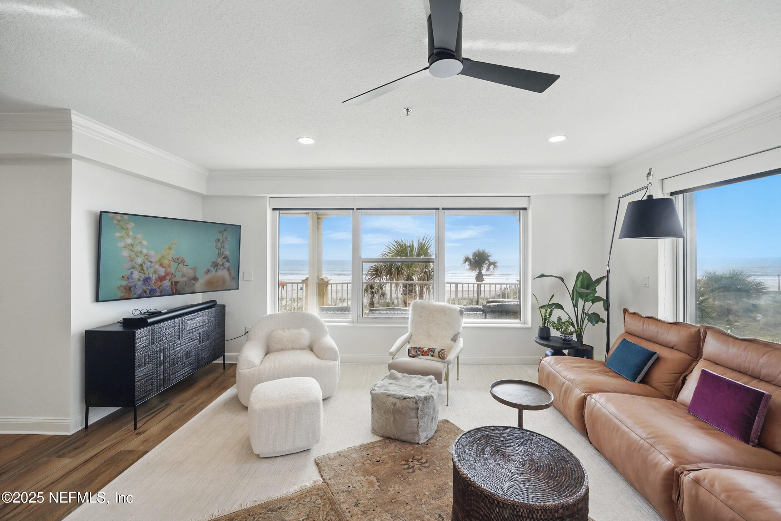 1505 1st Street South, Unit 302 Jacksonville Beach, FL 32250 - Photo 20 of 57 a living room with furniture and a large window
