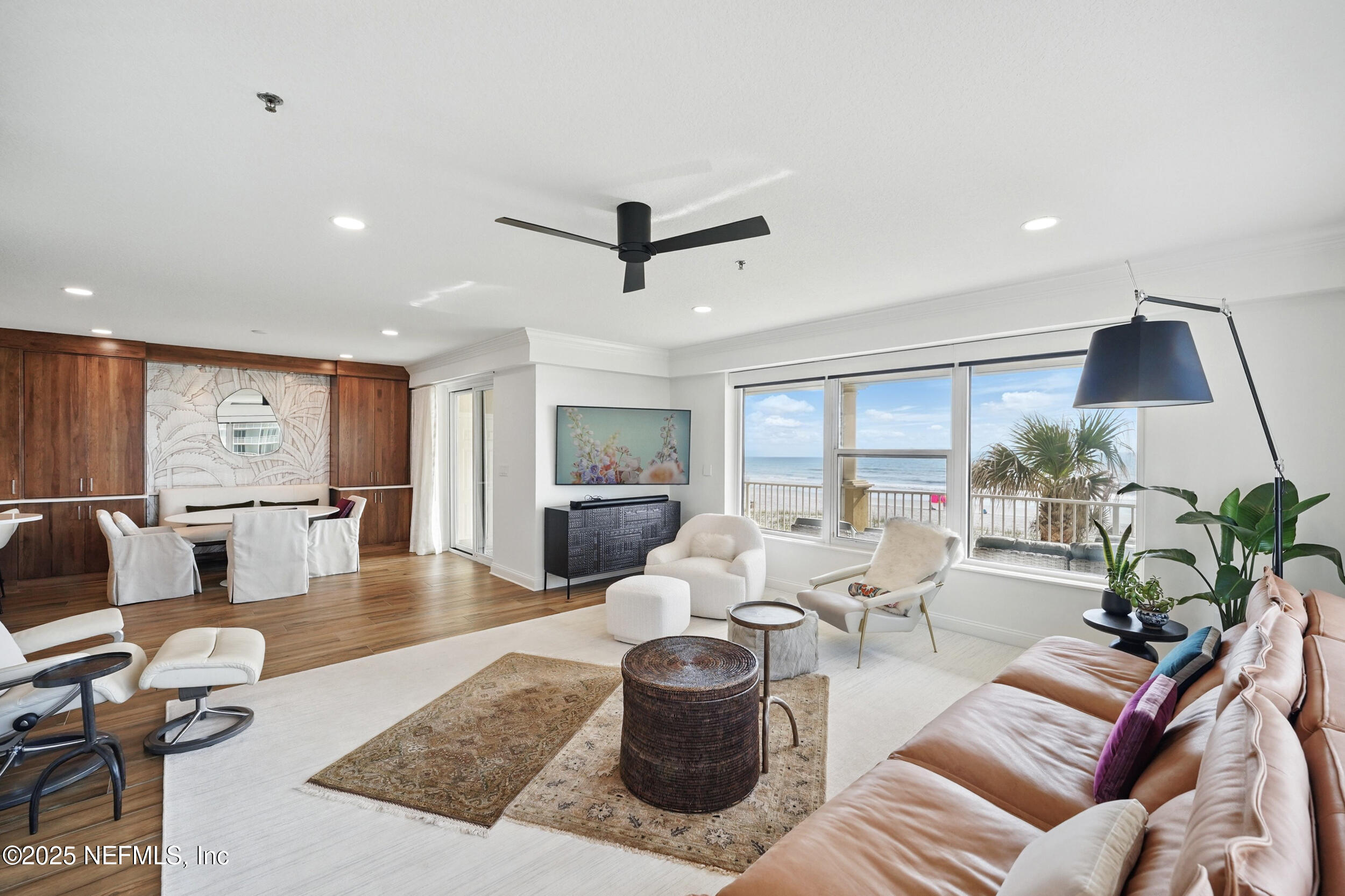1505 1st Street South, Unit 302 Jacksonville Beach, FL 32250 - Photo 21 of 57 a living room with furniture and a large window
