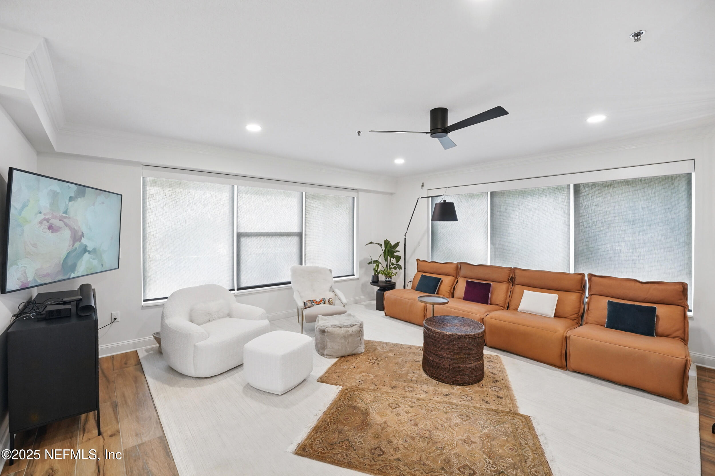 1505 1st Street South, Unit 302 Jacksonville Beach, FL 32250 - Photo 24 of 57 a living room with furniture ceiling fan and a window