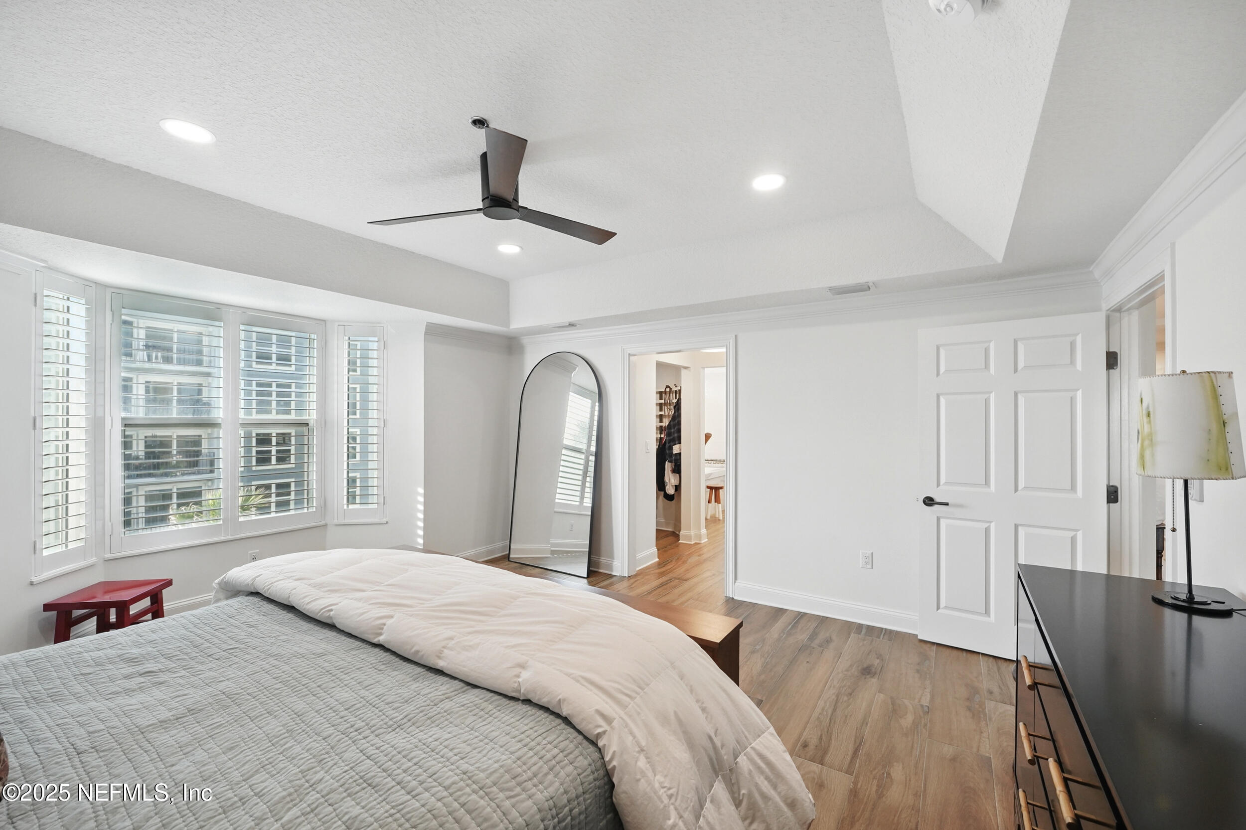 1505 1st Street South, Unit 302 Jacksonville Beach, FL 32250 - Photo 28 of 57 a bedroom with a bed and a large window