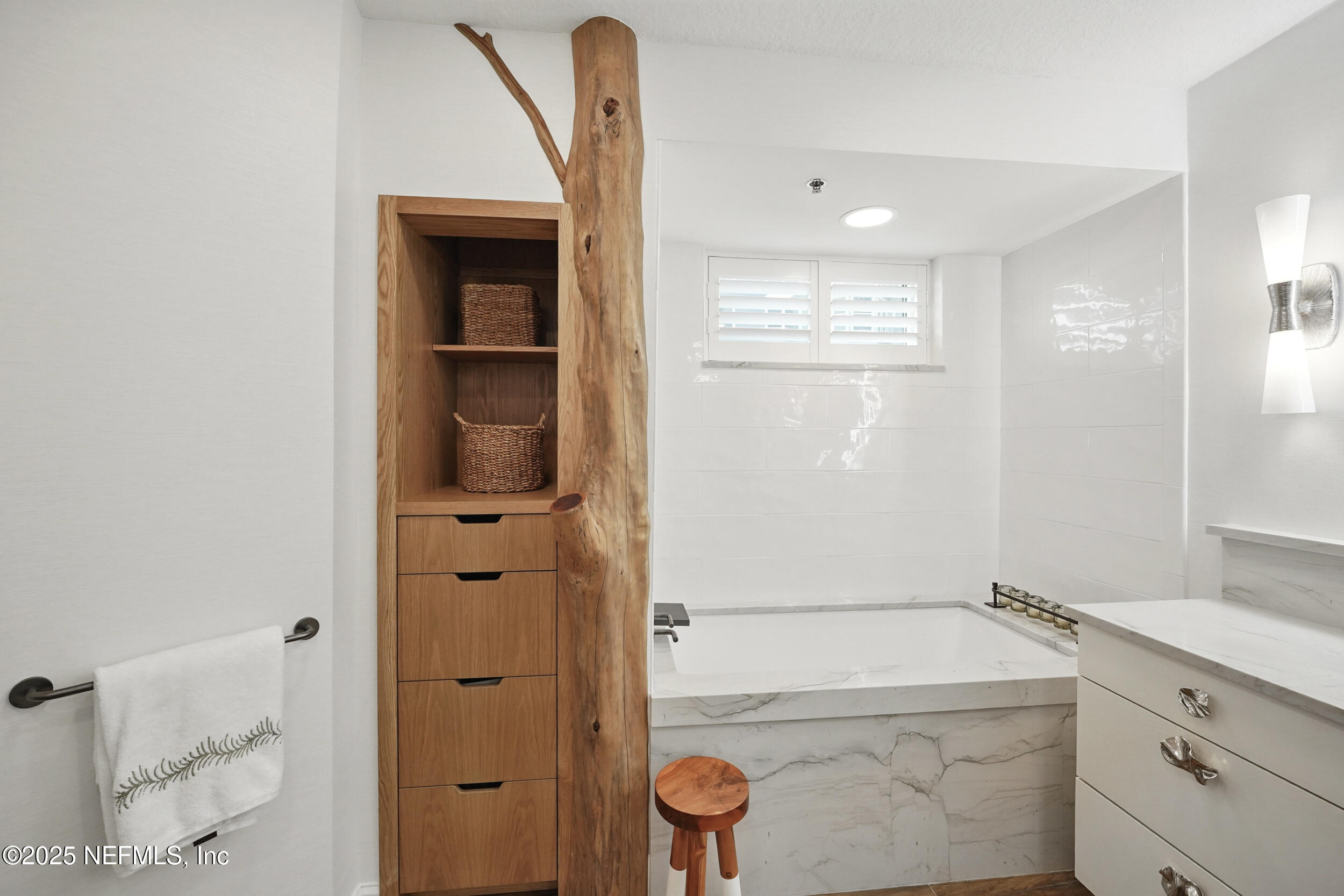 1505 1st Street South, Unit 302 Jacksonville Beach, FL 32250 - Photo 30 of 57 a bathroom with a tub sink and mirror