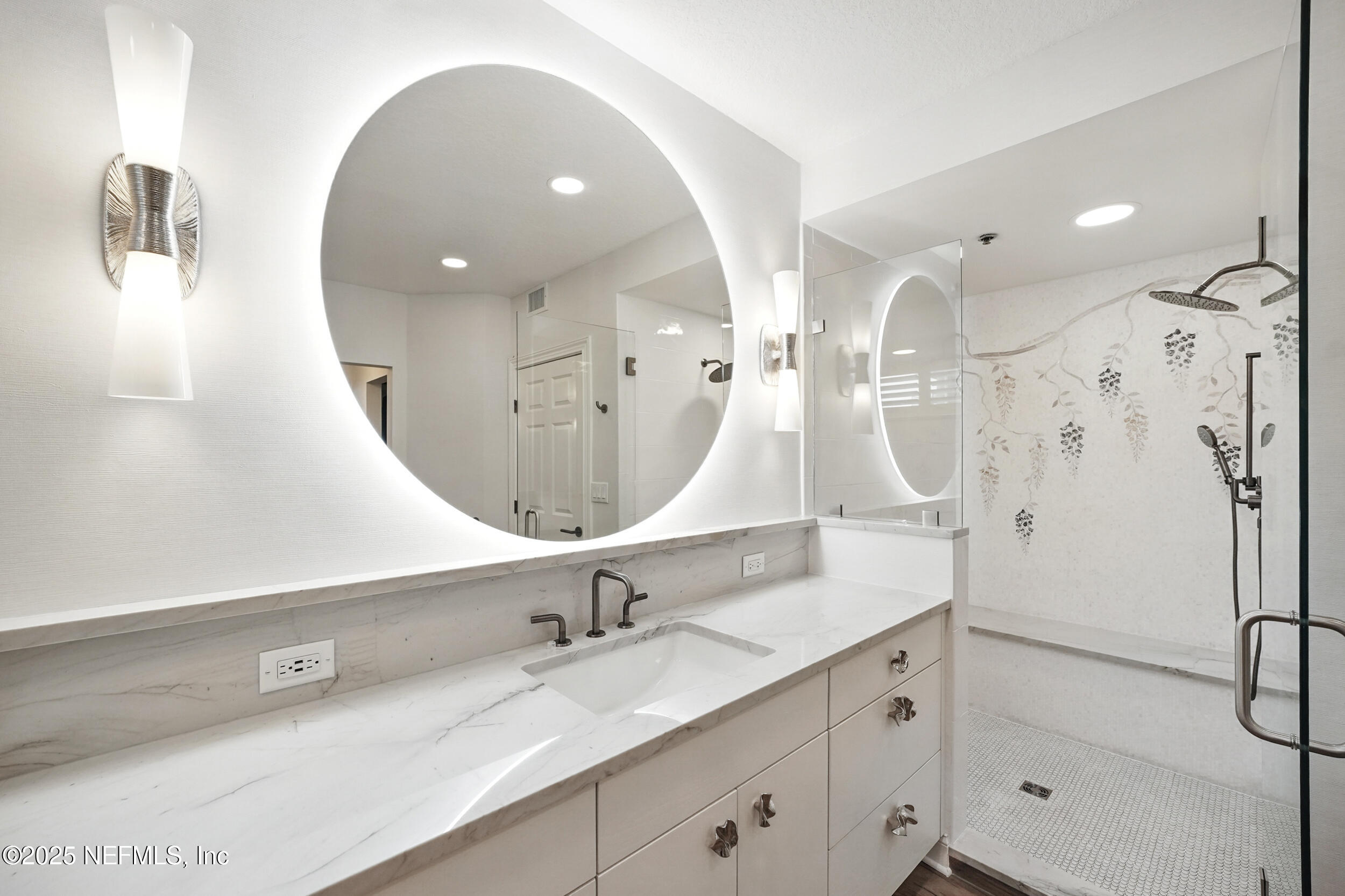 1505 1st Street South, Unit 302 Jacksonville Beach, FL 32250 - Photo 31 of 57 a bathroom with a sink double vanity and shower