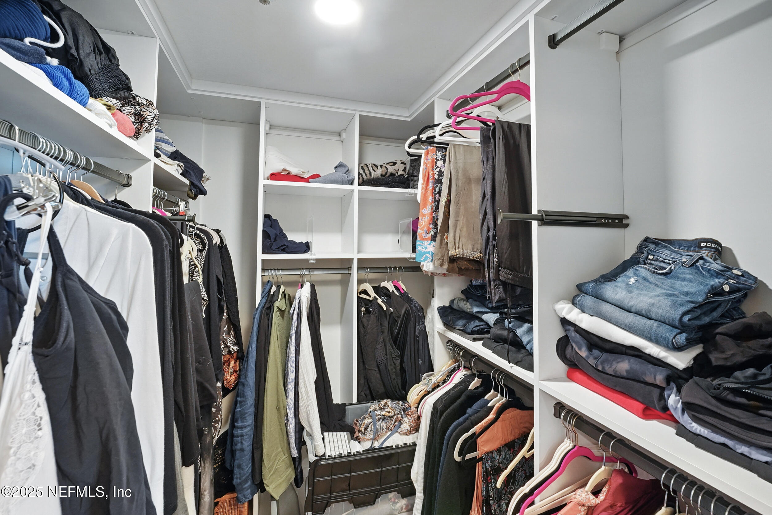 1505 1st Street South, Unit 302 Jacksonville Beach, FL 32250 - Photo 33 of 57 a view of walk in closet with clothes and shoes